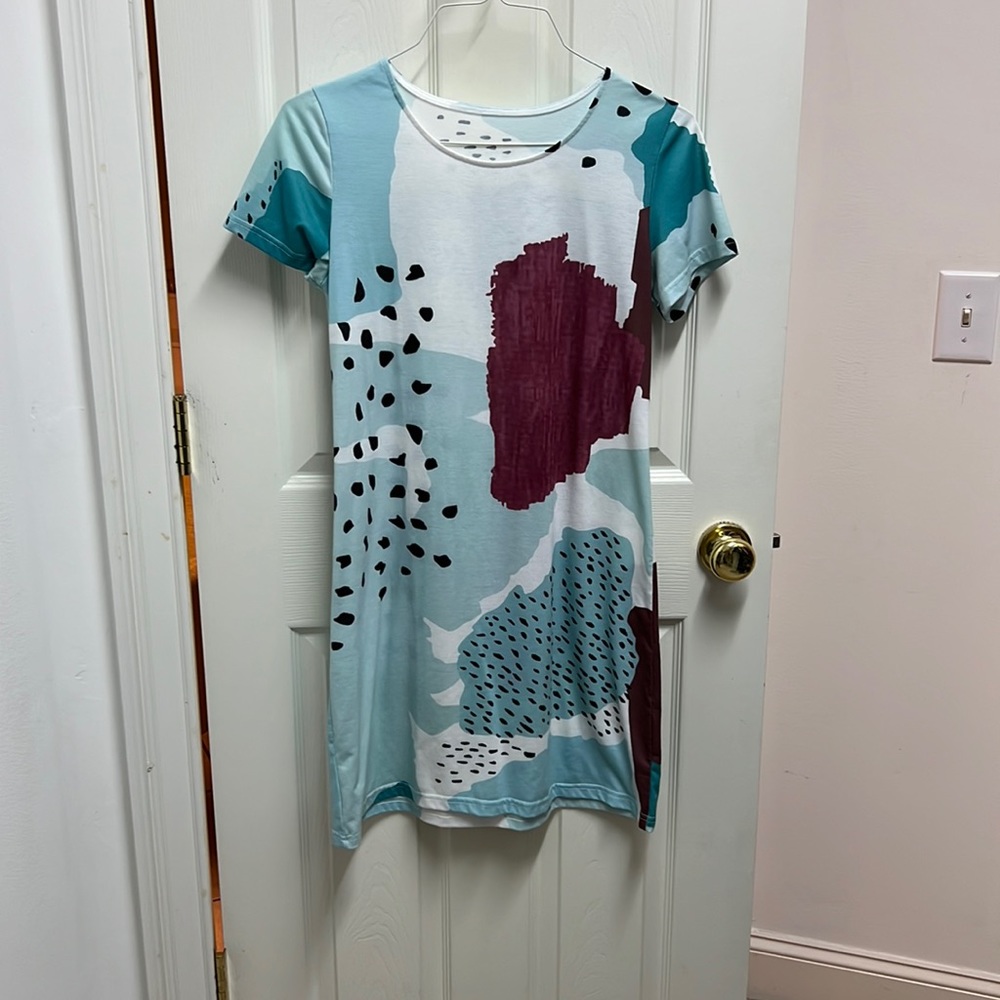 Boutique dress. Shirt sleeve. Super cute and cool pattern.